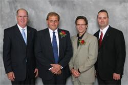 Chancellor Charles H. Casey, Richard Magnusson, Doug Aertz, and Director of Development & Alumni Relations Corby Kemmer