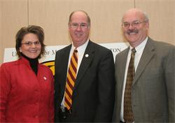 Athletic Director Stephanie Helgeson, Chancellor Charles H. Casey and Committee Chair Glenn Olsen, Ph.D.